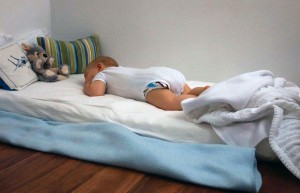 Pilar's five month old son sleeping through the night on his floor bed.